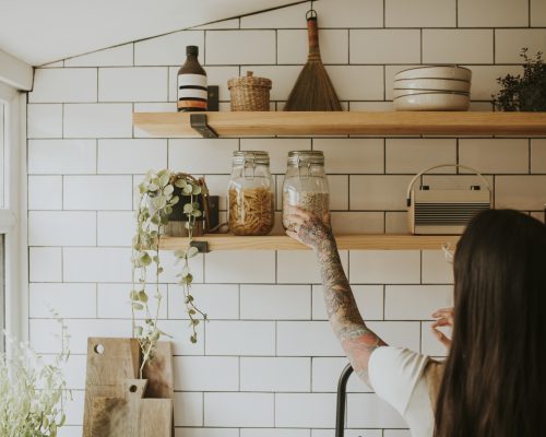woman-tidying-up-kitchen-wall-pantry